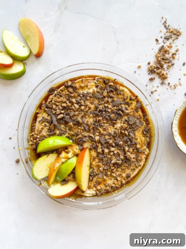 Close-up of Caramel Apple Dip with Heath Bar bits and a spoon
