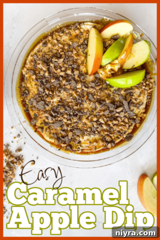 A large serving bowl of Caramel Apple Dip with fresh apple slices and dippers