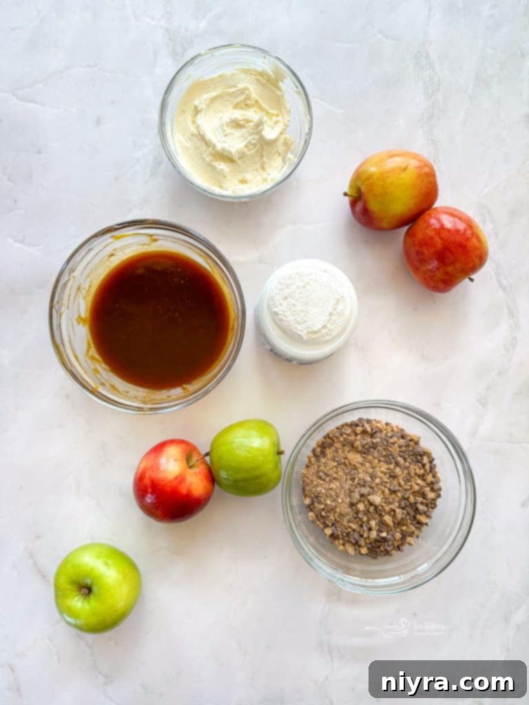 A serving dish of Caramel Apple Dip with fresh apples surrounding it