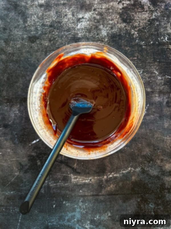 Decadent White Chocolate Raspberry Truffle Cheesecake 17 Fully baked White Chocolate Raspberry Cheesecake cooling on a wire rack