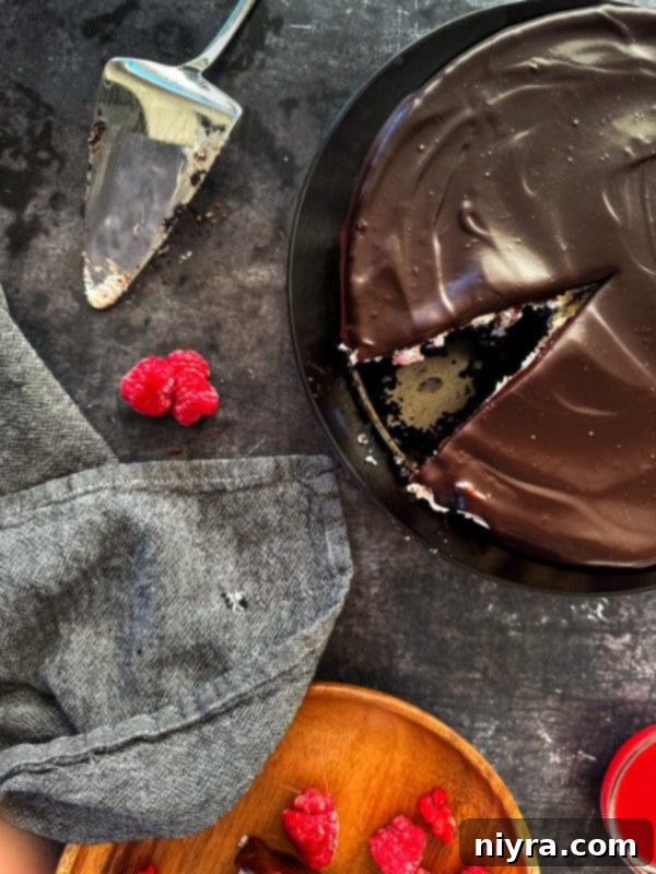 Decadent White Chocolate Raspberry Truffle Cheesecake 22 Close-up of the rich white chocolate cheesecake filling