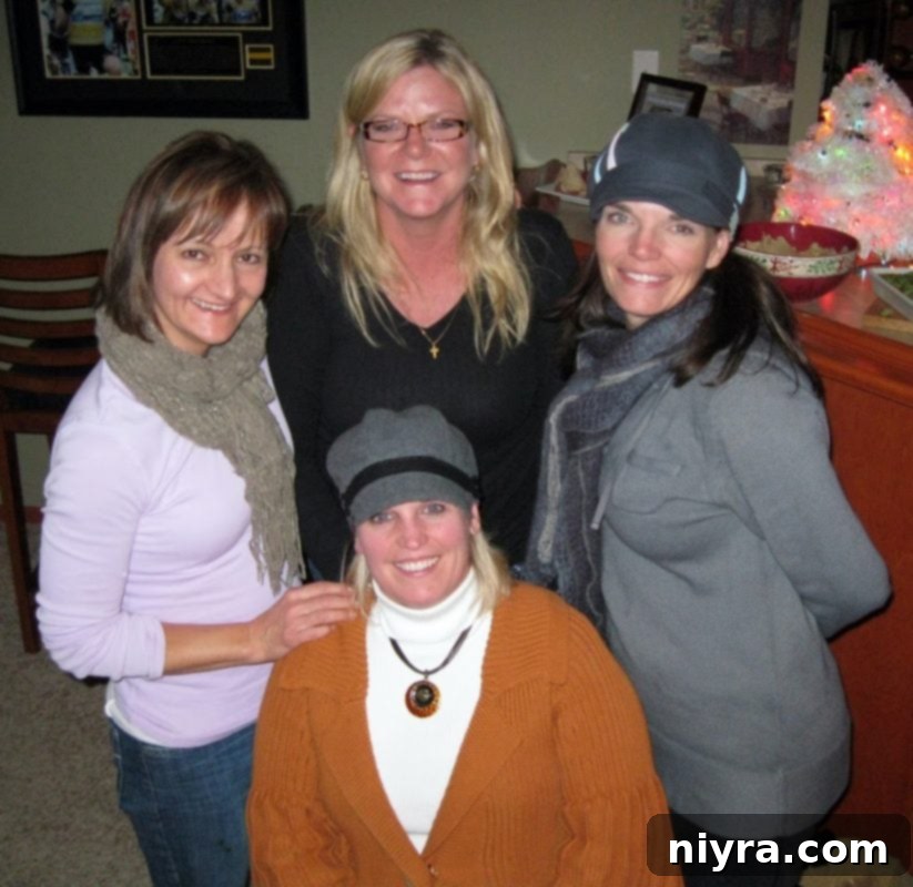 Decadent White Chocolate Raspberry Truffle Cheesecake 24 Four friends gathered around a table, enjoying desserts and conversation