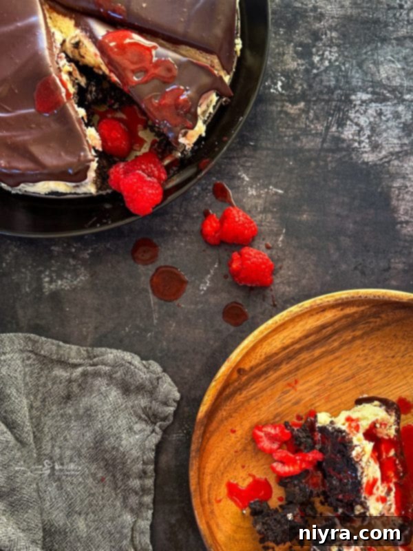 Decadent White Chocolate Raspberry Truffle Cheesecake 4 Close-up of the elegant layers and raspberry swirl in White Chocolate Raspberry Cheesecake