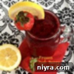 Refreshing Frozen Triple Berry Lemonade in a glass mug