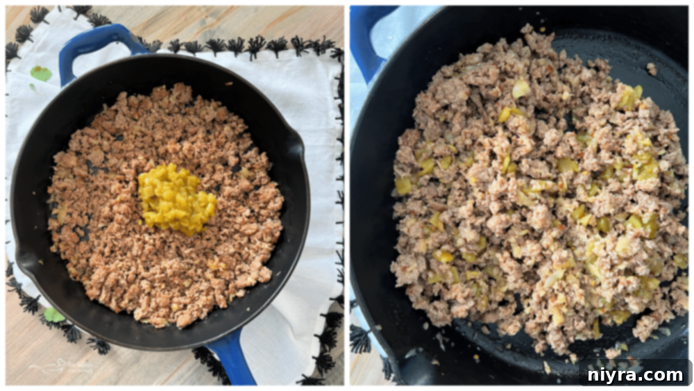 Ground sausage, onion, and red pepper flakes cooking in a skillet.