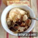 Overhead of apple cinnamon crumble with vanilla ice cream and text "apple cinnamon crumble"