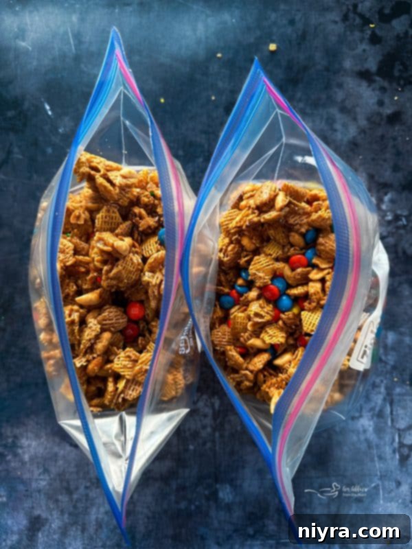 Irresistible Candy Coated Crispix Treat 15 Crispix Mix cooling on a baking sheet before adding M&Ms