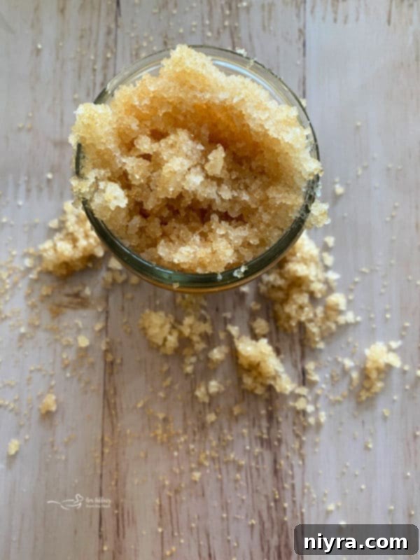 Refreshing eucalyptus mint sugar scrub in a glass container.