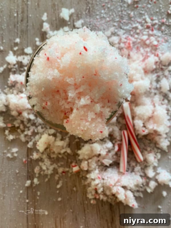 Festive peppermint sugar scrub with candy canes.