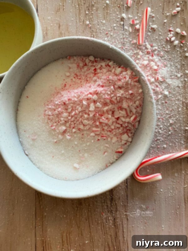 Close-up of peppermint sugar scrub with crushed candy canes.