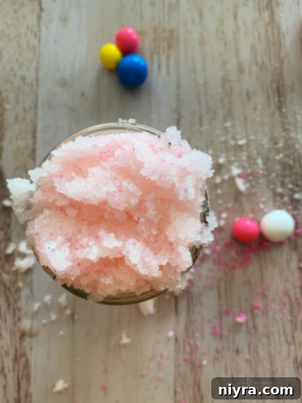Vibrantly pink bubblegum sugar scrub in a jar.