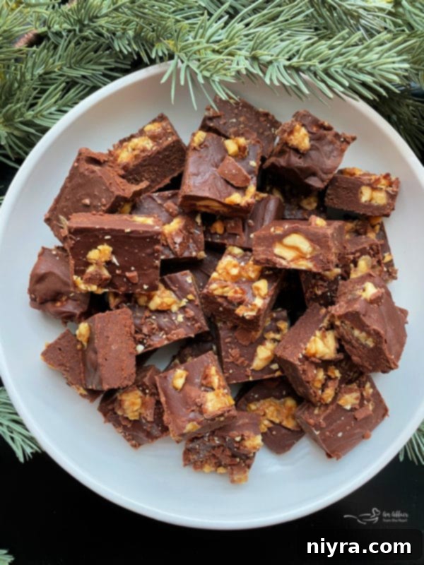 Delicious Snickers Candy Bar Fudge squares, perfect for holidays