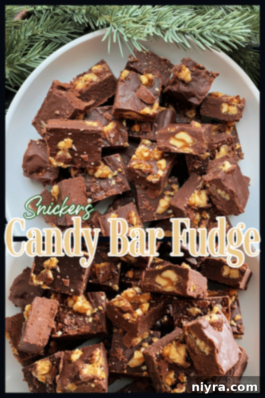 Easy candy bar fudge with snickers ready to be shared