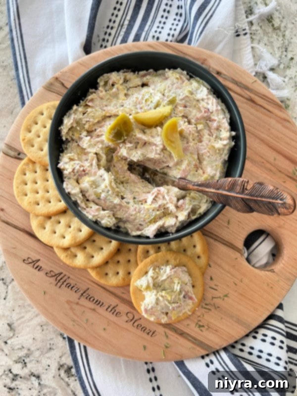Dilled Brussels Sprouts Dip in a bowl with crackers and vegetables