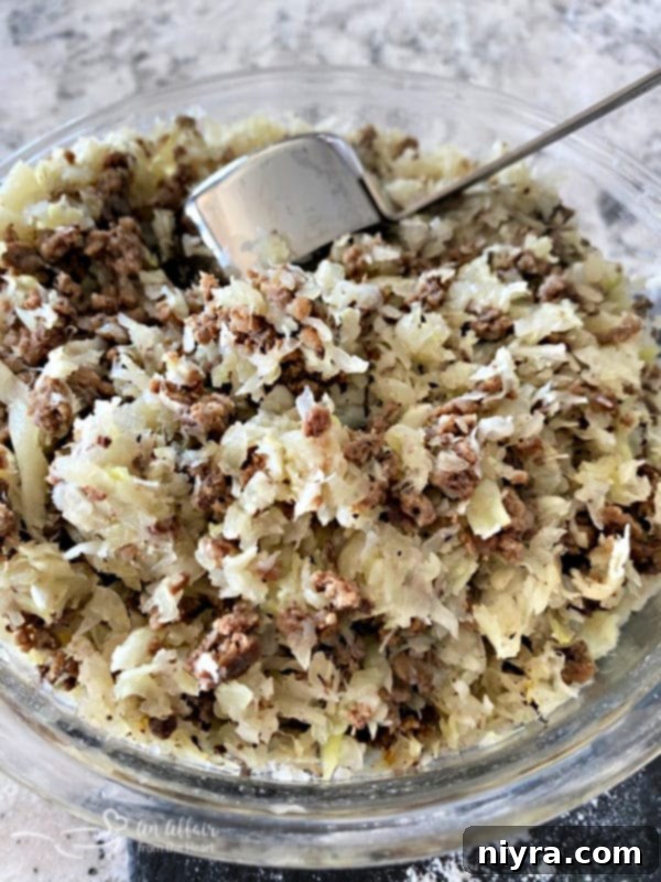 Runza filling in a bowl, made with ground beef, cabbage, and onion