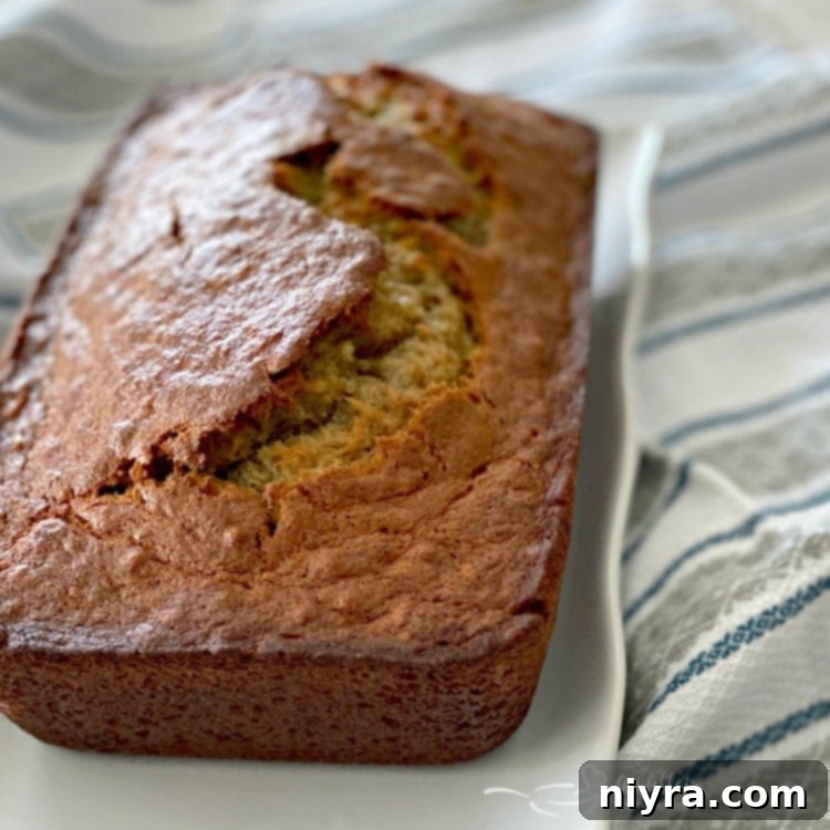Unforgettable Banana Bread 4 Sliced Banana Bread on a Wooden Cutting Board