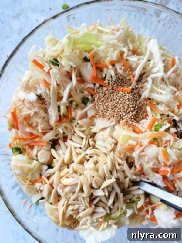 Mixing Chinese Chicken Salad ingredients