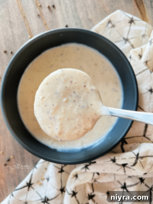 Classic Southern White Gravy 2 Homemade White Country Gravy poured over a dish