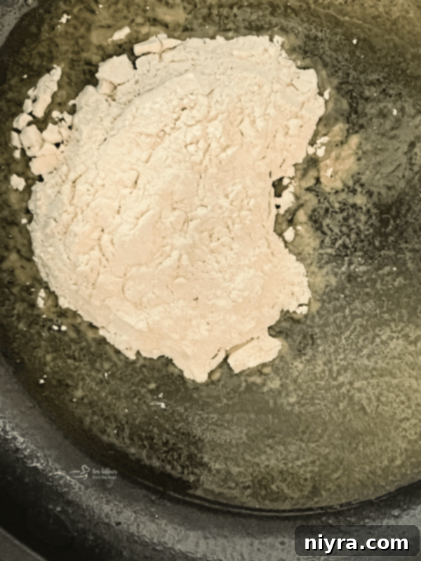 Classic Southern White Gravy 7 Whisking flour into melted butter to make a roux