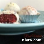 Side view of Red Velvet Truffles arranged on a light blue plate