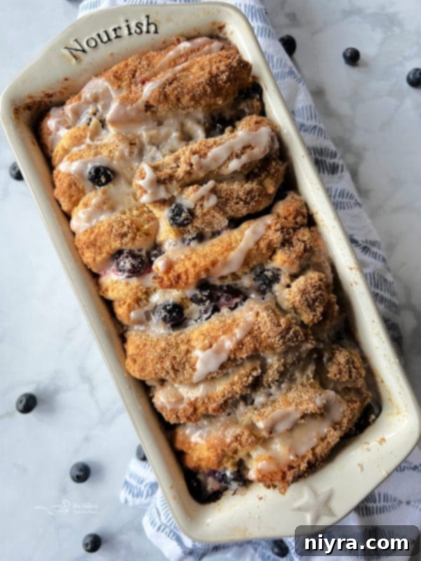 Close-up of two slices of Blueberry Lemon Pull-Apart Bread, showing the layers of streusel and blueberries