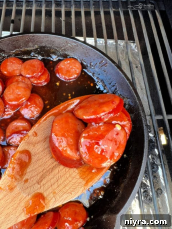 BBQ Smoked Sausage Sandwiches with side dishes on a table