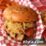 BBQ Smoked Sausage Sandwiches on a bun with kraut