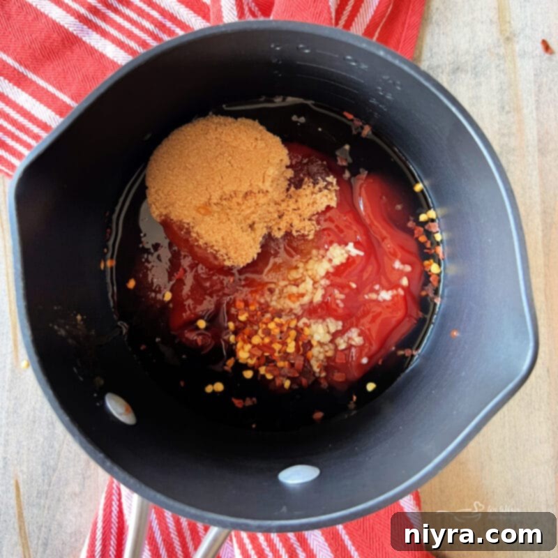 Mixing homemade BBQ sauce ingredients in a saucepan