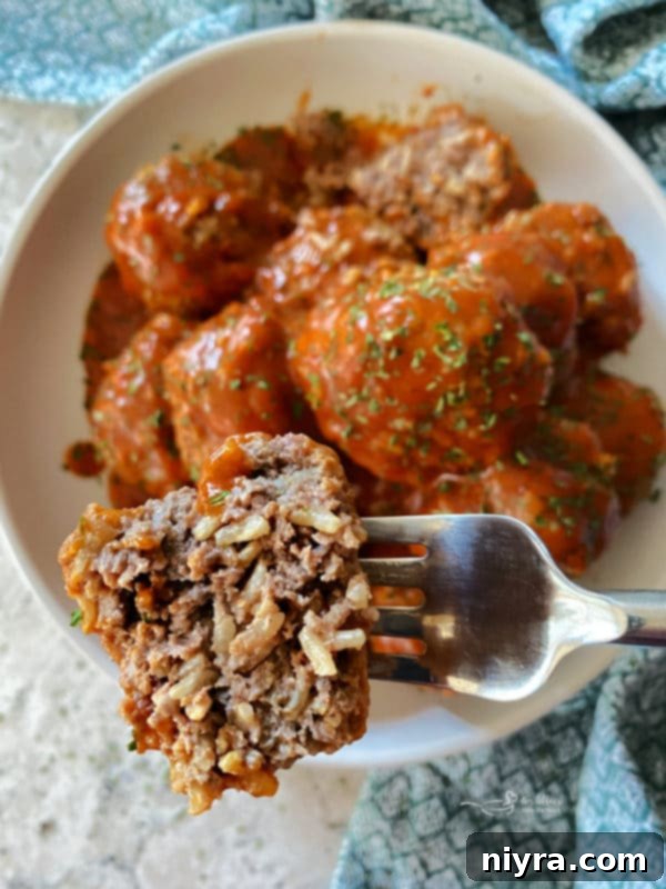 Porcupine Meatballs simmering in tomato sauce