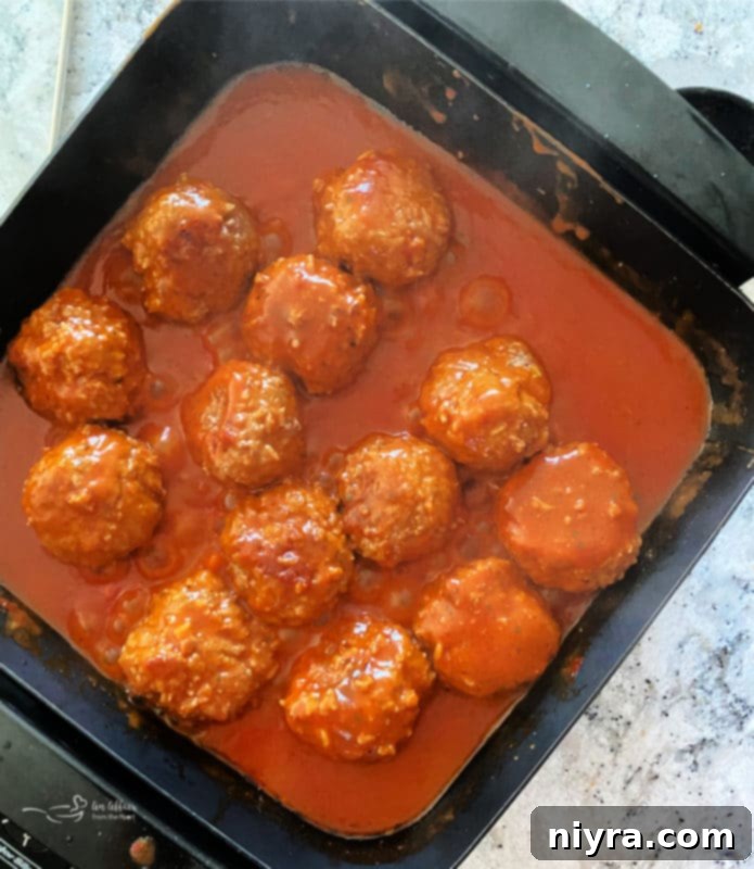 Cooked porcupine meatballs in a skillet