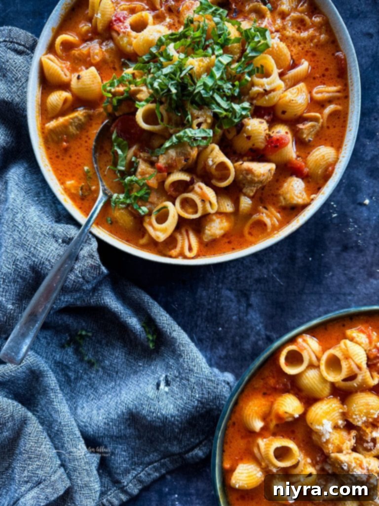 Close up of Creamy Chicken Parmesan Soup, another comforting recipe.