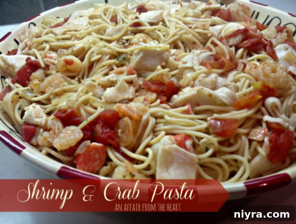 A vibrant bowl of shrimp and crab pasta, garnished with fresh herbs and a lemon wedge, sitting on a wooden surface.