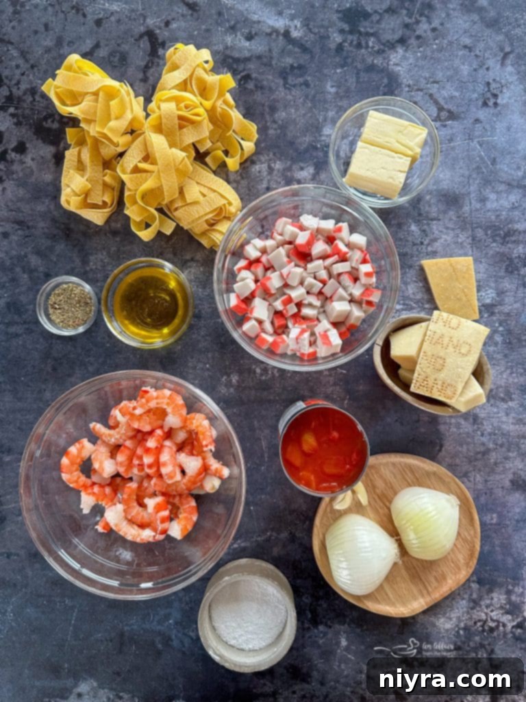 A beautifully presented bowl of Shrimp and Crab Pasta on a rustic wooden table.