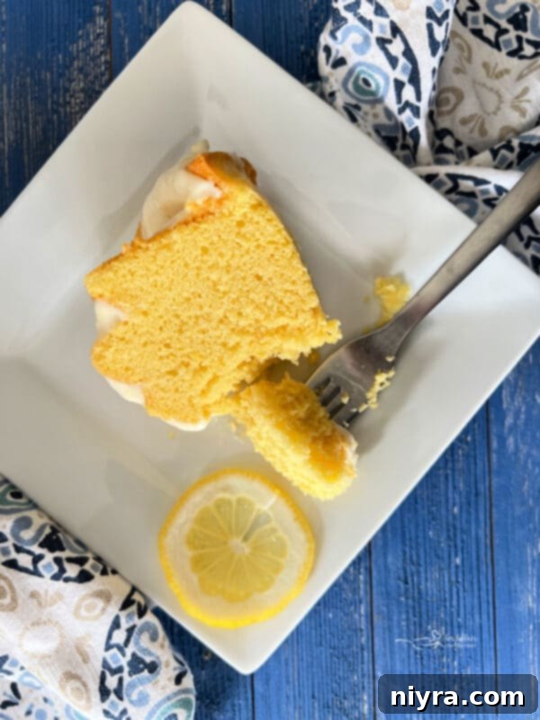 Lemon Cream Cheese Pound Cake with Fork on Plate