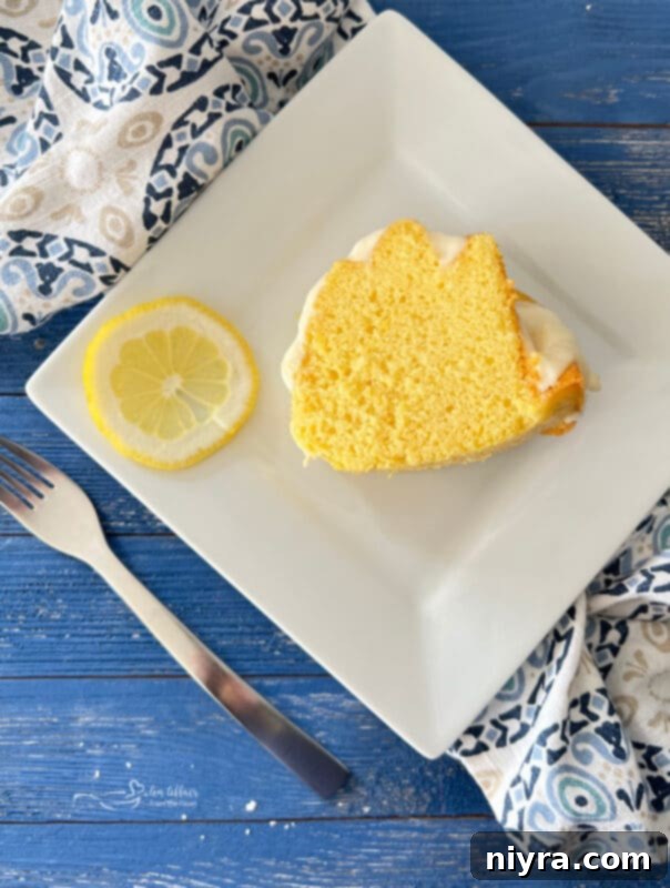 Lemon Cake with Slice of Lemon on Plate