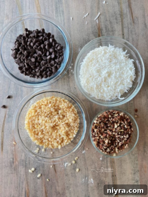 A second image of ingredients, focusing on the mix-ins like Rice Krispies, shredded coconut, pecans, and chocolate chips.