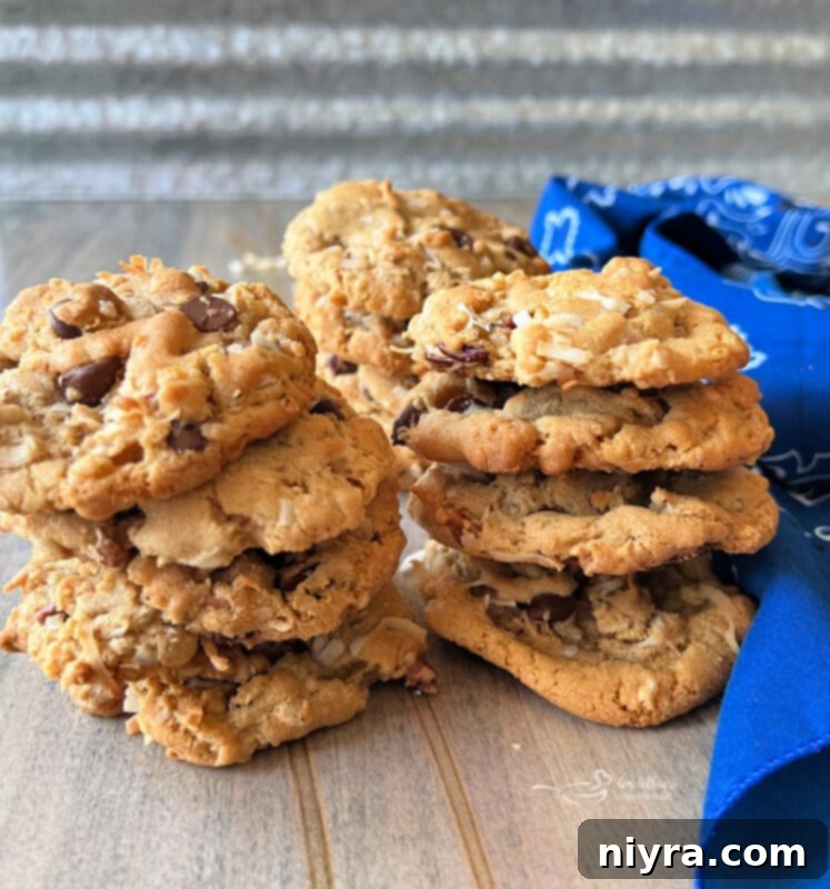A vibrant close-up of a freshly baked Cowboy Cookie, showing its texture and enticing mix-ins.