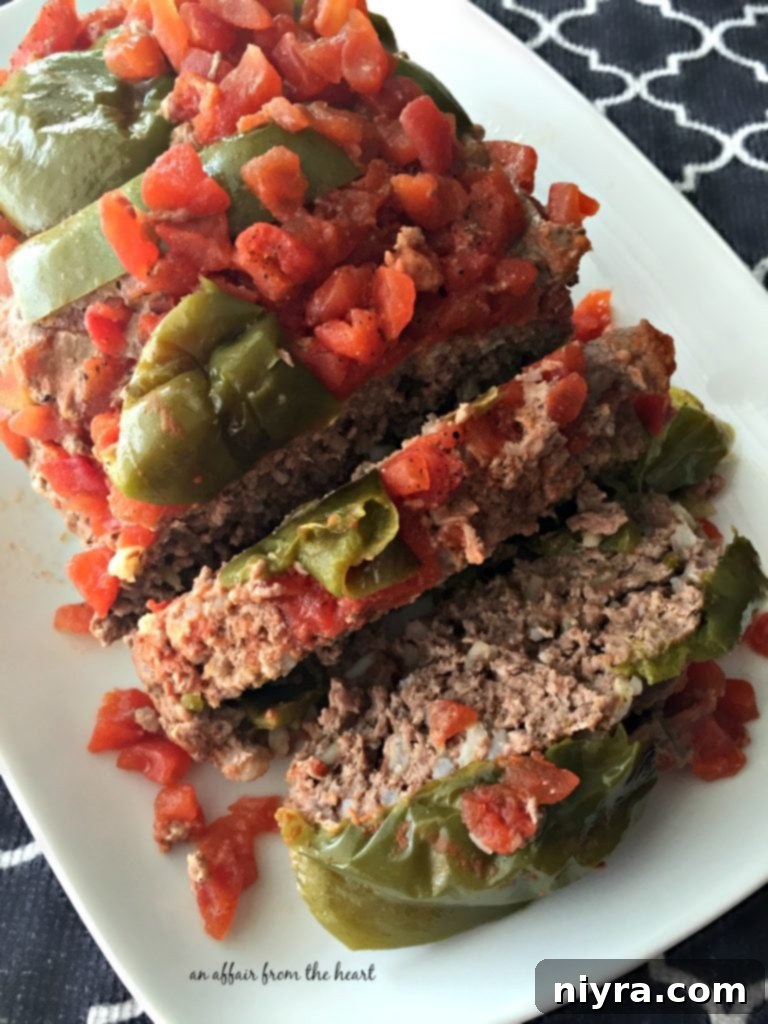 Delicious Stuffed Pepper Meatloaf served on a white platter, ready to eat