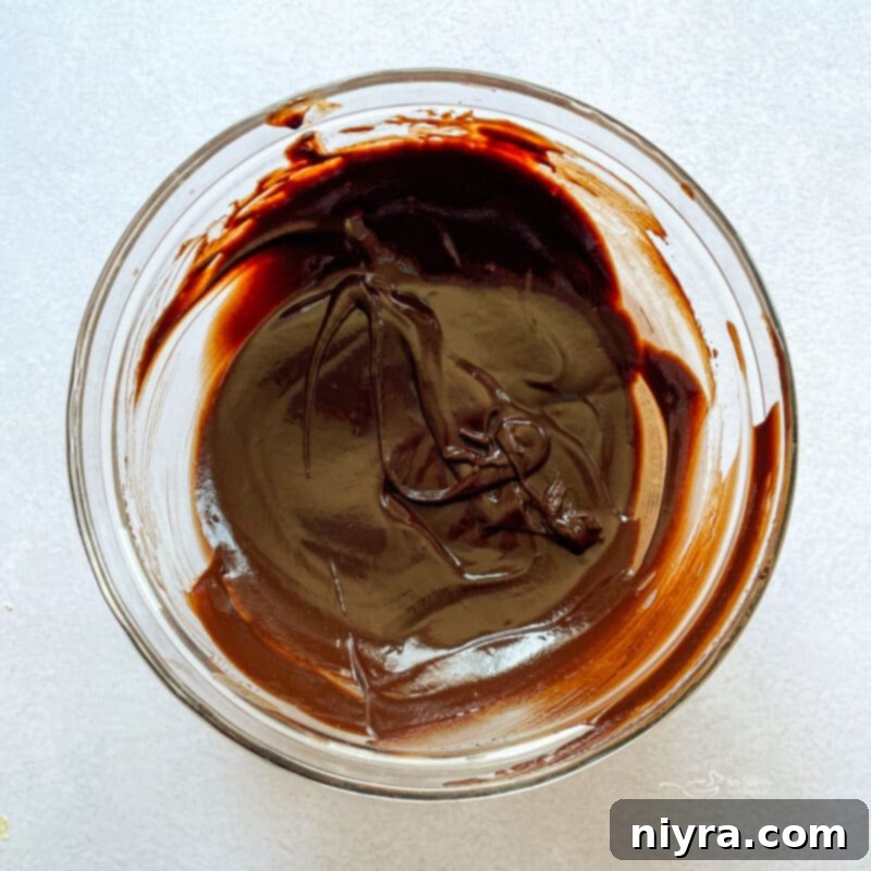 Melting chocolate and cream for Nanaimo Bar ganache