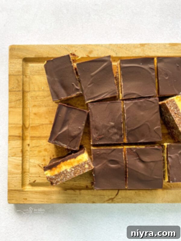 A piece of Nanaimo Bar with a bite taken out