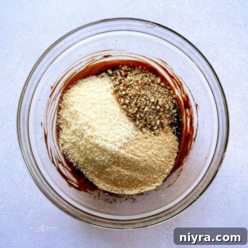 Baking dish lined with parchment paper for Nanaimo Bars