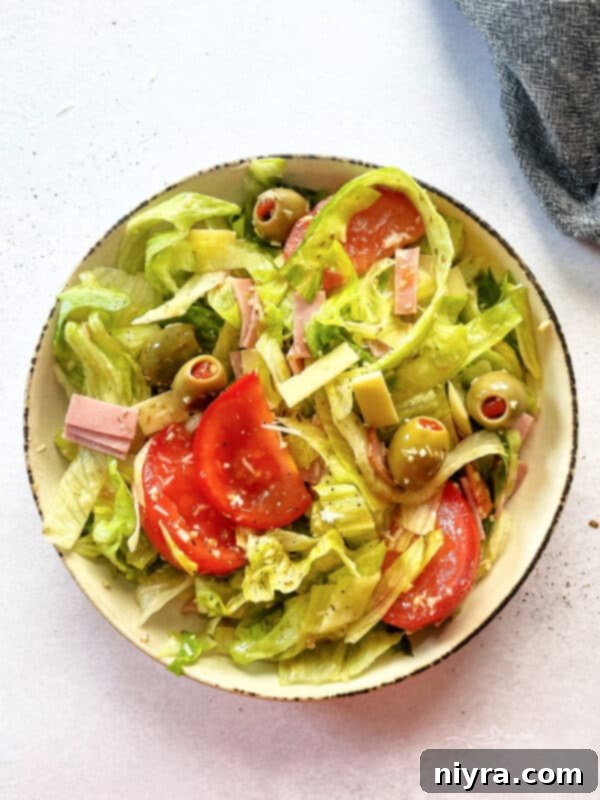 Columbia 1905 Salad, a Tampa Classic, made with crisp lettuce, ham, Swiss cheese, tomatoes, and Spanish olives.