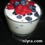 overhead of ice cream with berries in it