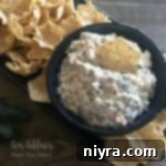 Champion's Irresistible Dip 12 Close up of {Award Winning} Crack Dip in a black bowl with chips around it