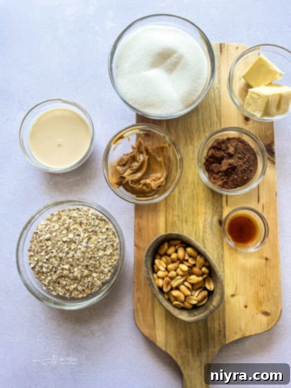 Three chewy chocolate peanut butter no-bake cookie bars stacked on a white plate, showcasing their rich chocolate and peanut butter layers.
