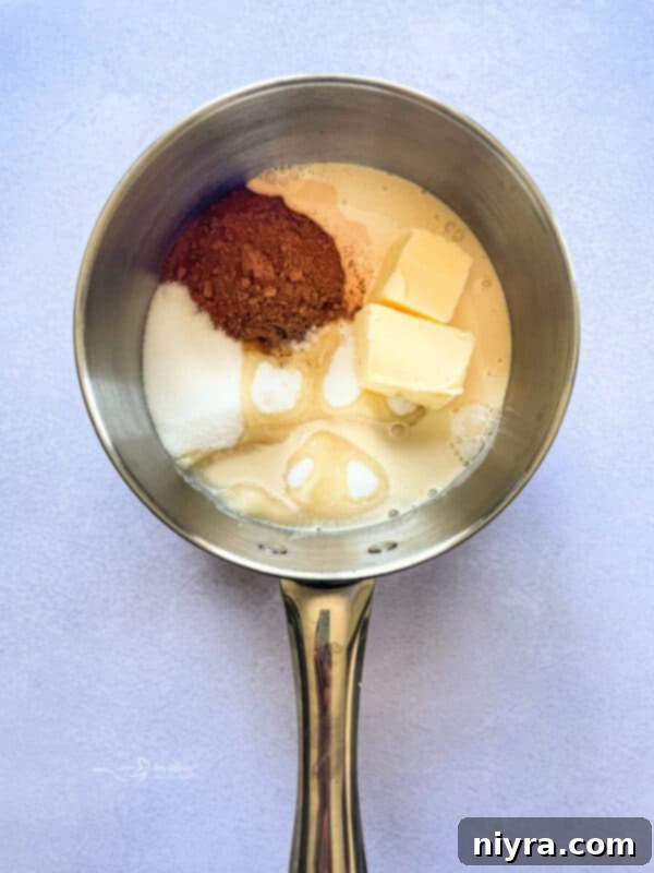 Baking dish lined with parchment paper, lightly buttered and ready for the no-bake mixture.