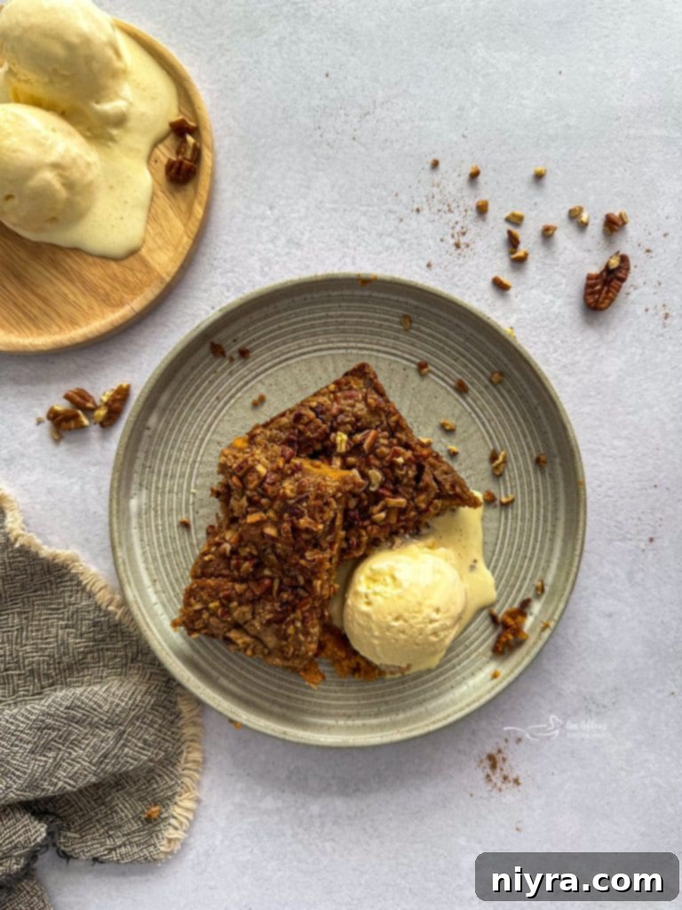 A large pan of freshly baked Pumpkin Dump Cake, with a golden crumbly top and a rich pumpkin filling
