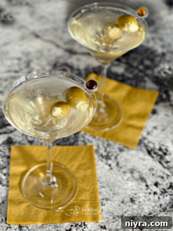 Two Dirty Vodka Martinis with bleu cheese stuffed olives, a gourmet twist