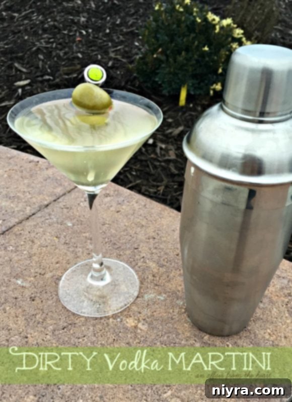 A perfectly prepared dirty vodka martini with olives