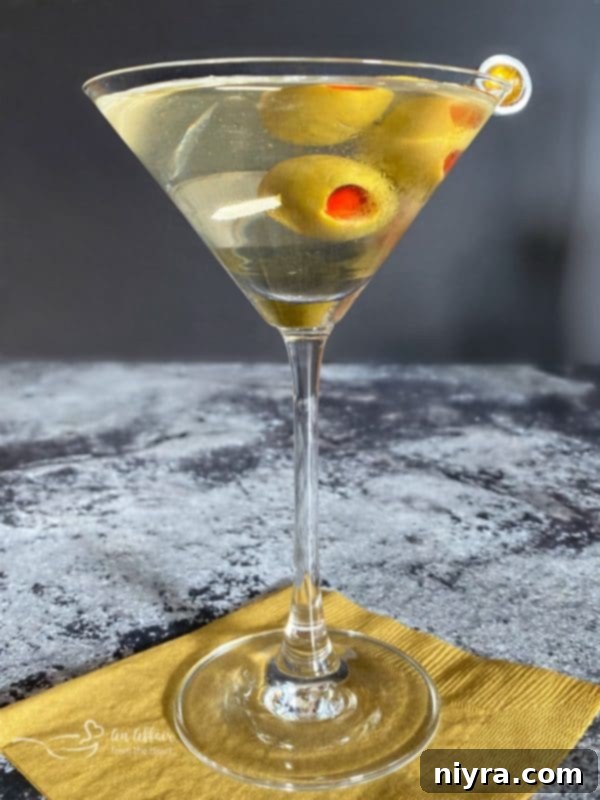 Dirty Vodka Martini with olives, garnished elegantly